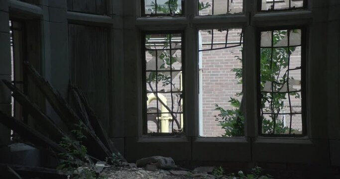 medium day interior of broken windows in abandoned building