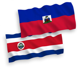 Fototapeta premium National vector fabric wave flags of Republic of Costa Rica and Republic of Haiti isolated on white background. 1 to 2 proportion.