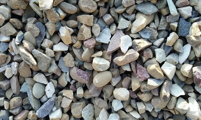 Abstract background with lot of various shape peeble stones. 