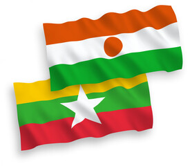 National vector fabric wave flags of Republic of the Niger and Myanmar isolated on white background. 1 to 2 proportion.