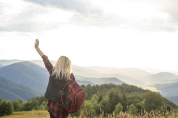 woman backpacker enjoy the view at mountain