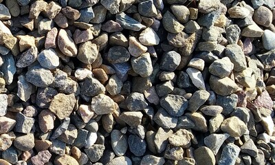 Abstract background with lot of various shape peeble stones. 