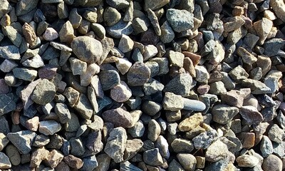 Abstract background with lot of various shape peeble stones. 