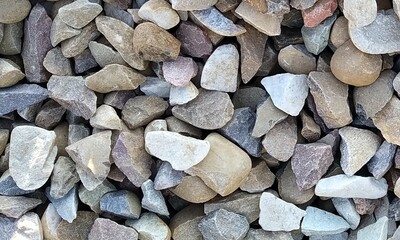 Abstract background with lot of various shape peeble stones. 