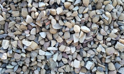 Abstract background with lot of various shape peeble stones. 