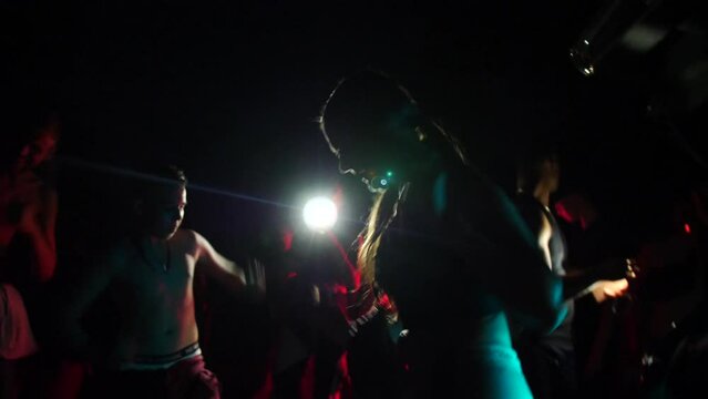Active People Dancing In The Street At Night. Illegal Rave Party. medium shot