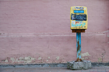 Old mailbox with graffiti on the street of Kyiv
