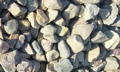 Abstract background with lot of various shape peeble stones. 