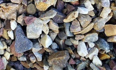 Abstract background with lot of various shape peeble stones. 