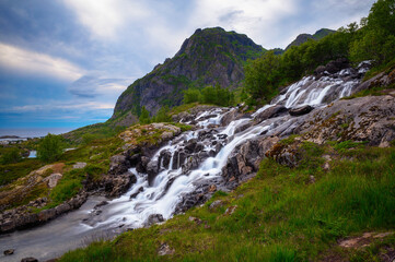 Fototapeta na wymiar Lofoten waterfall on Moskenesoya, Lofoten, Norway