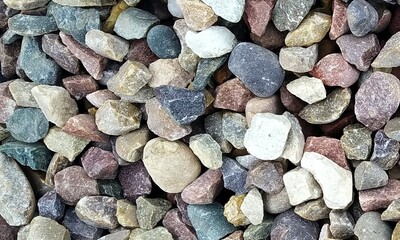Abstract background with lot of various shape peeble stones. 