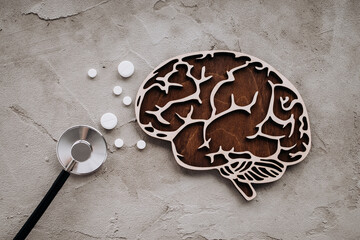 A stethoscope and brain with pills. Awareness of Alzheimer's, Parkinson's disease, dementia,...