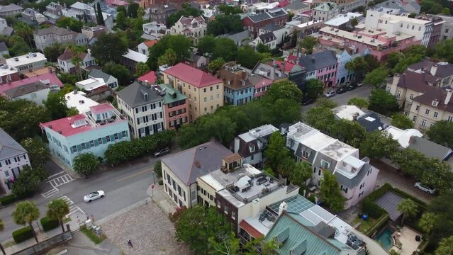 An overhead tracking drone shot of Rainbow Row in Charleston, SC.