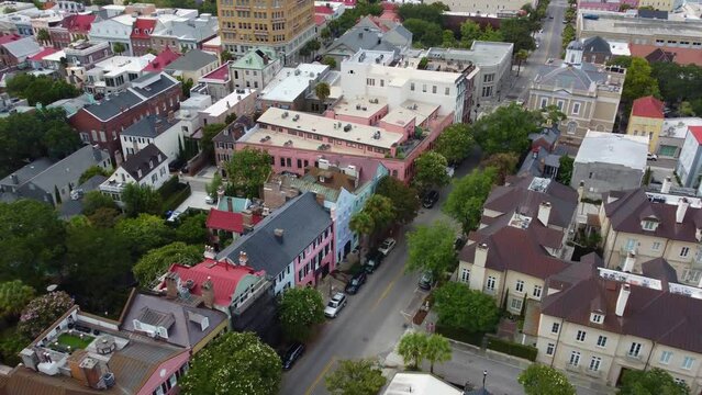 A drone shot running parallel of Rainbow Row, in Charleston, SC.