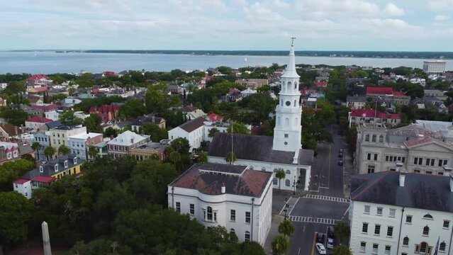 An orbiting drone shot showing off Charleston's skyline and St. Michael's Anglican Church in Charleston, SC.