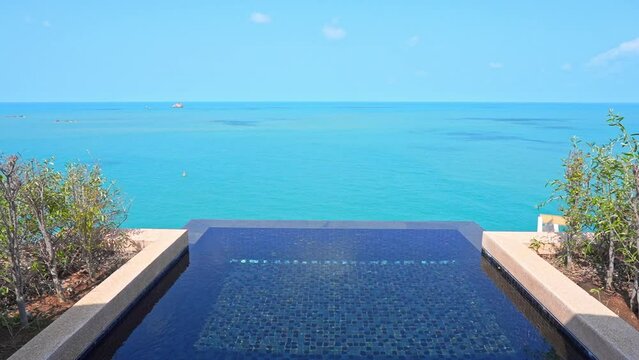 Infinity Pool of Private Villa With Stunning View of Blue Tropical Sea Skyline