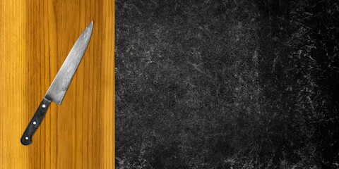 Topview of Cooking Knife and Cutting Board on Dark Background