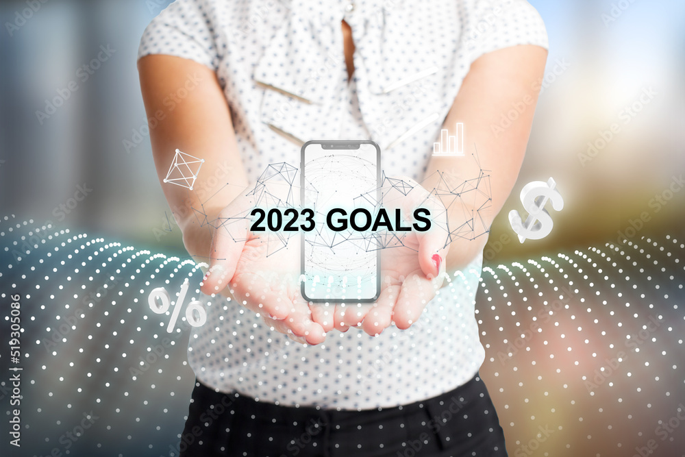 Sticker Business, Technology, Internet and network concept. Young businessman working on a virtual screen of the future and sees the inscription: 2023 goals