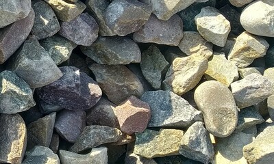 Abstract background with lot of various shape peeble stones. 