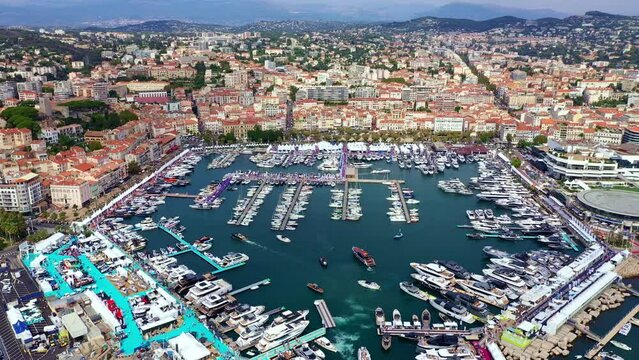 Vieux port - Cannes, France Aerial view of the beautiful port with yachts, surrounded by Mediterranean sea. 
Cannes Yachting Festival - September 2021