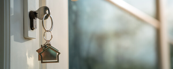 House doors with keys for new homes, new owners, buying and selling homes and real estate...
