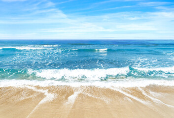 Wide angle beach photo of sky, sea and sand as a luxury summer holiday background or backdrop....