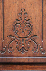 Carved details on vintage wooden door