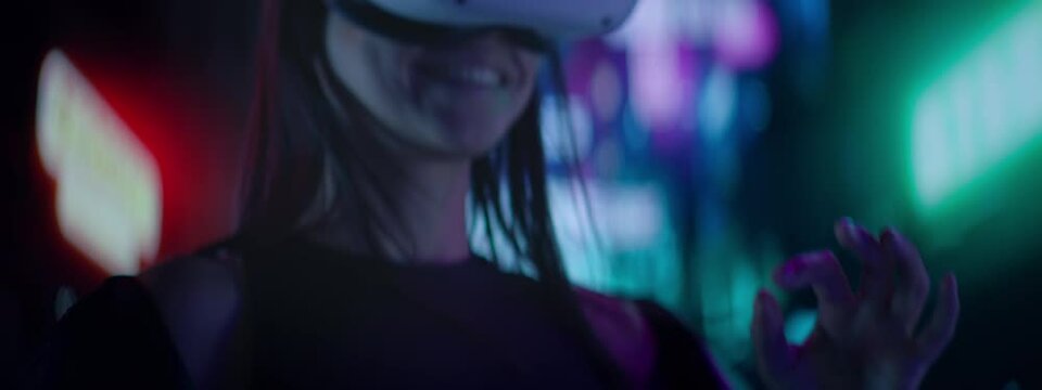 CU Portrait of Hispanic female using her VR metaverse headset in the street full of neon lights, Hong Kong asian style background