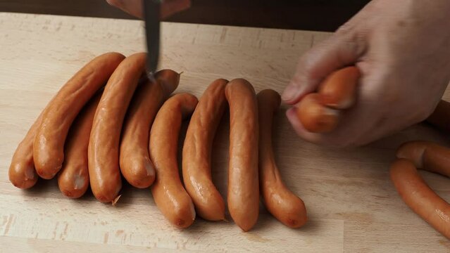 Pork sausages on the wooden cutting board