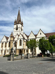 Fototapeta na wymiar The Sibiu Lutheran Cathedral on a sunny day, Romania 2022