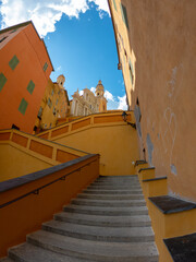 The Basilica of Saint-Michael the Archangel in Menton, France. The tall bell tower on the right...