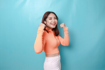 Fototapeta premium A young Asian woman with a happy successful expression