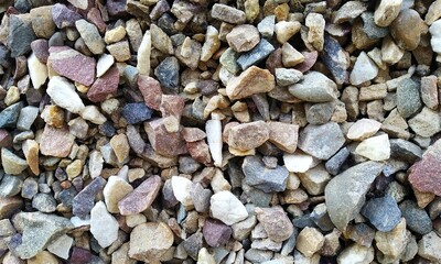 Abstract background with lot of various shape peeble stones. 
