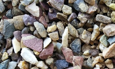 Abstract background with lot of various shape peeble stones. 