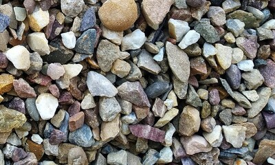 Abstract background with lot of various shape peeble stones. 