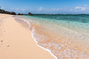 Incredible turquoise crystal clear sea water at a paradise beach in a sunny day.