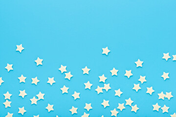modern trendy pattern of sprinkles for design banner, poster, flyer, card, postcard, cover, brochure over blue background, copy space