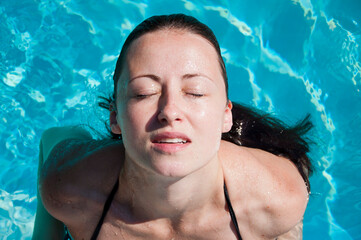 sexy young woman swim in swimming pool. swimmer girl in swimming pool. summer vacation swimming pool