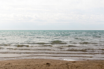 Sandy beach with blue sea and blue sky and white cloud is beautiful on the coast. beautiful blue ocean shore outdoor nature landscape water background.