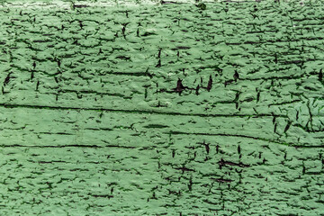 Texture of old wooden green shabby planks with cracks and stains. Abstract background of wood table top. Horizontal strips. Copy space. Aged effect boards. Retro style backdrop. Vintage wallpaper