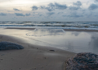 landscape with sea shore, rocks in water and sand, December, Vidzeme rocky seashore, Latvia