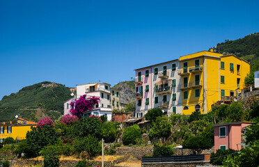 Obraz premium Travel to Cinque Terre (Five Lands in English). Aerial view over Corniglia architecture landmark village at the coast of Liguria Sea from Italy. 