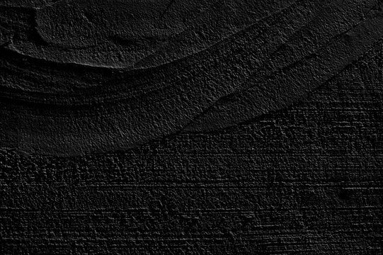 Fototapeta An old grunge background with a black wall texture. Black paint on the wall . Abstract background.Rough brush strokes with black paint.
