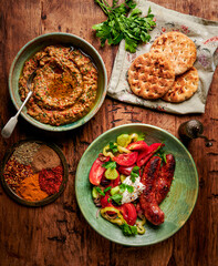 Grilled sausage and tomato salad