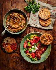 Grilled sausage and tomato salad