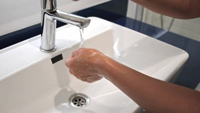 Washing hands rubbing with soap voman for corona virus prevention, hygiene to stop spreading covid omicron