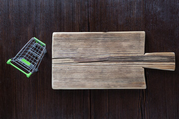 Empty cutting board on wooden brown background. copy space for text