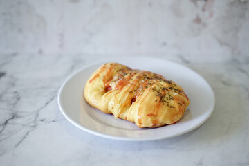Sausage buns bread. Soft baked bun (dough) stuffed with sausage for fast food breakfast or coffee break. Sausage roll, (hot dog).
With mayo, tomato sauce, mozarella cheese and parsley topping
