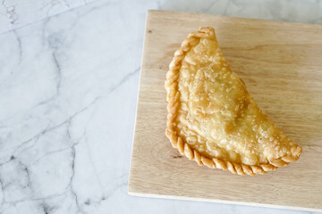 Cornish pasty filled with chicken and potato. Pastry minced pie or Pastel asian style cuisine....