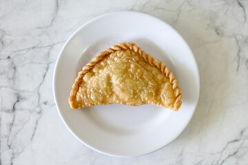 Cornish pasty filled with chicken and potato. Pastry minced pie or Pastel asian style cuisine....